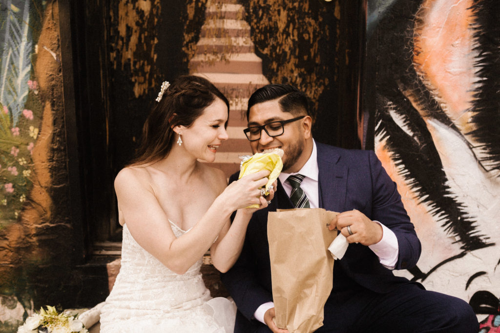 bride and groom eating a burrito