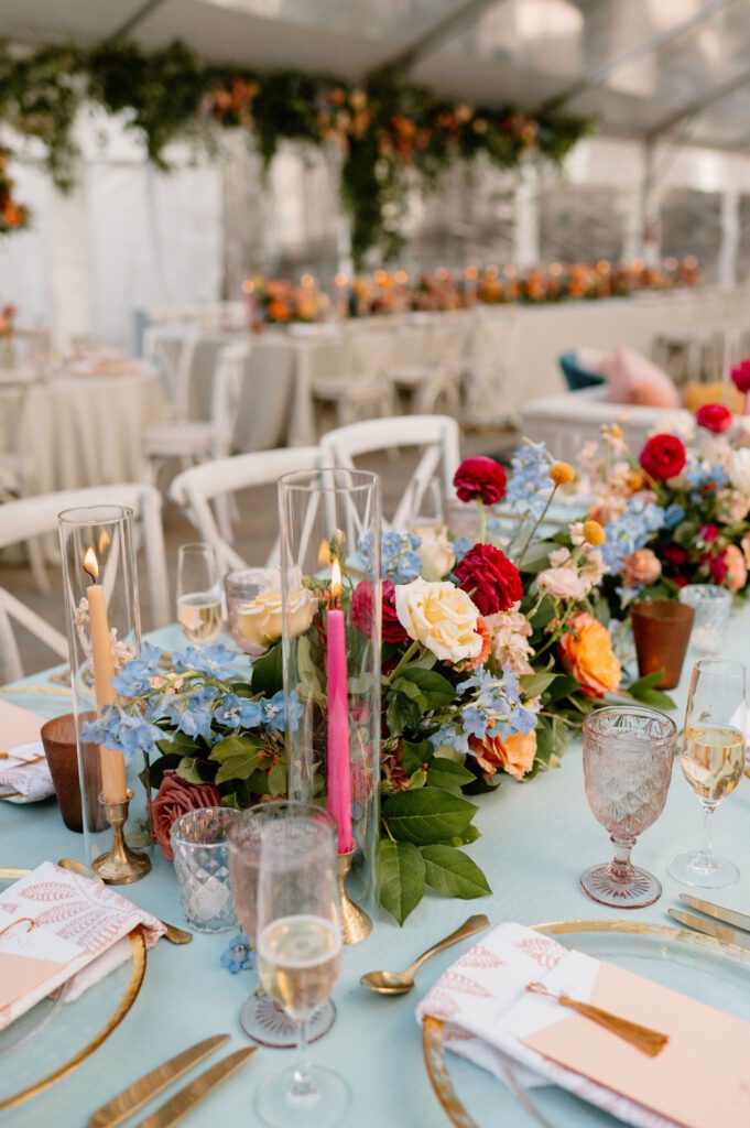 colorful taper candles on luxury wedding tablescape